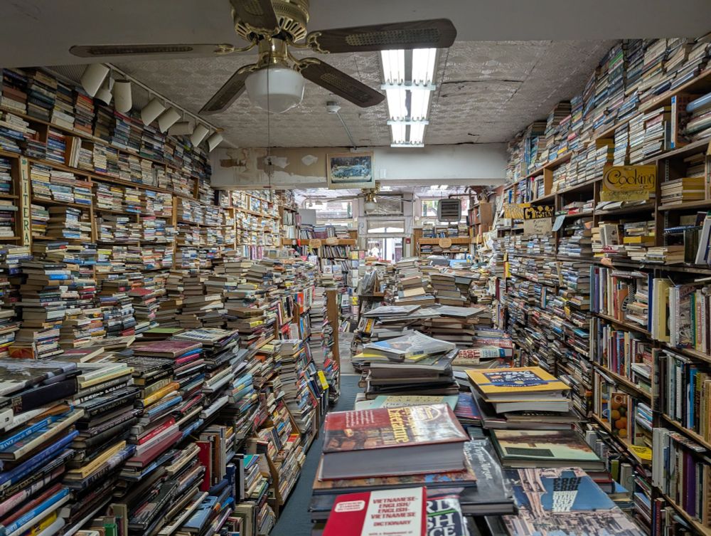 Books in piles, stacked sideways
