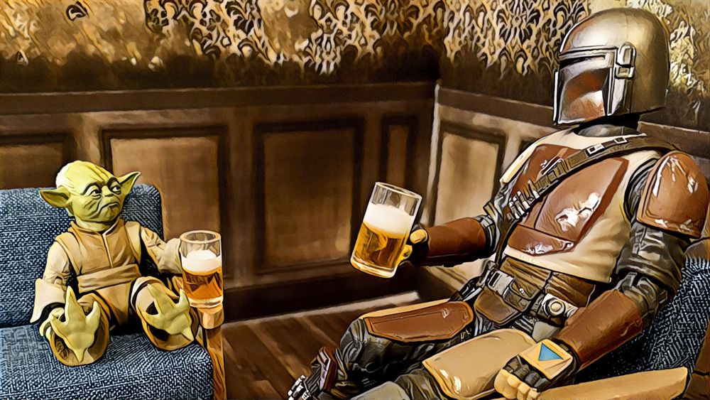 Yoda and the Mandalorian sit catty corner on blue fabric chairs each holding a frost mug of beer 

#actionfigure #toyphotography #toy #actionfigurephotography #photography #starwars #mandalorian