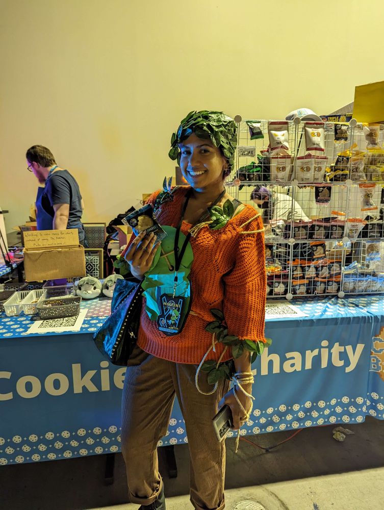 a person in cosplay holding cookies.