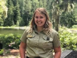 A national parks servicewoman in a forest