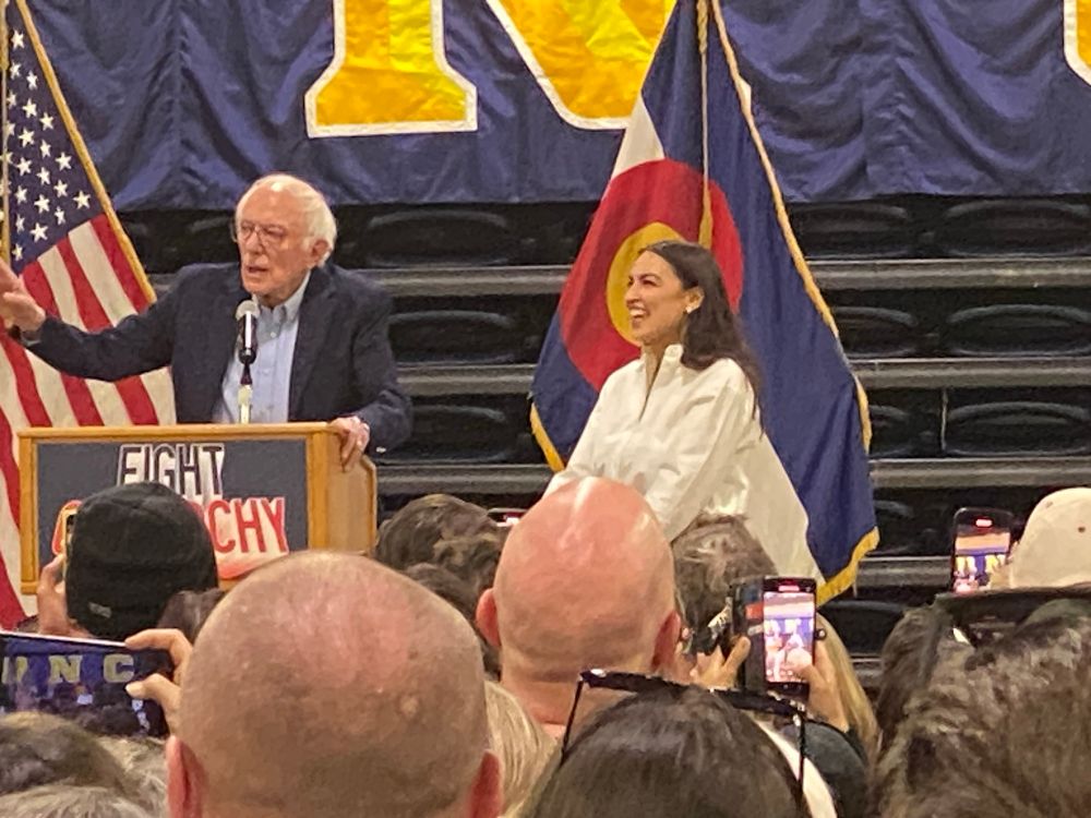 Bernie Sanders and Alexandria Ocasio Cortez on stage. 