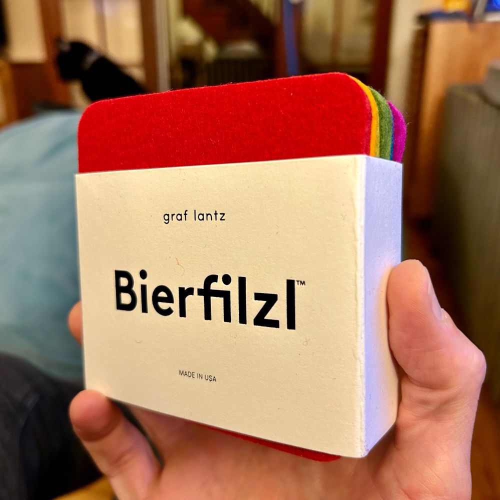 a pack of six coasters Bierfilzl, or “beer felt”, in various colors