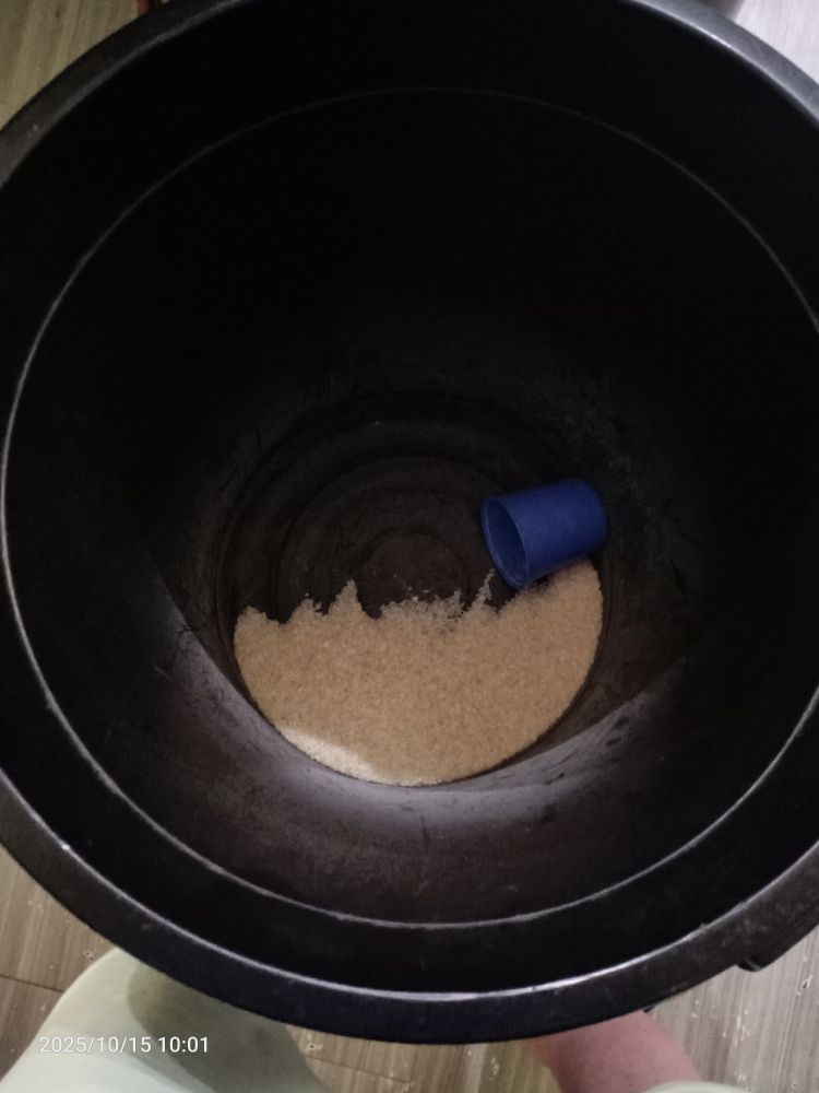 A photo down into our rice bin showing that there is only a couple of scoops left.