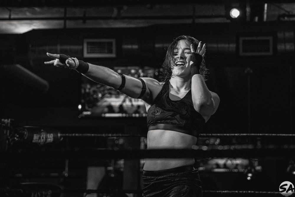Spike Nishimura poses as her name is announced before her match at Beyond Wrestling: Pop Culture