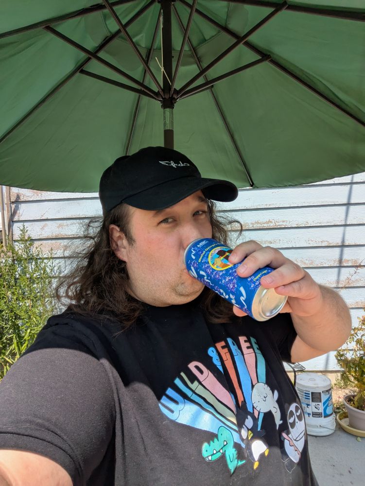 Jaye,a fat pinkish blob with wild hair wearing a black baseball cap with the word fuck in cursive and an off brand sanrio t shirt sipping a purple can with lavender rights projects logo on it
