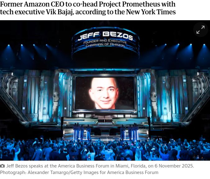 Jeff Bezos and his giant bald head on a screen with a large crowd beneath