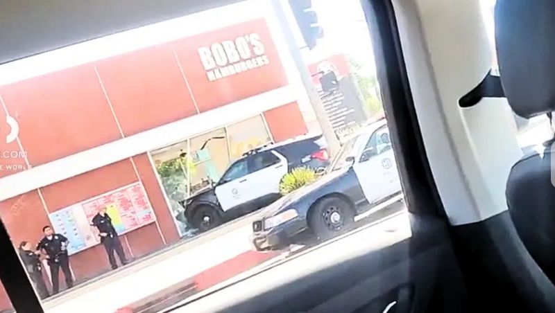 Police car into the front of a hamburger store