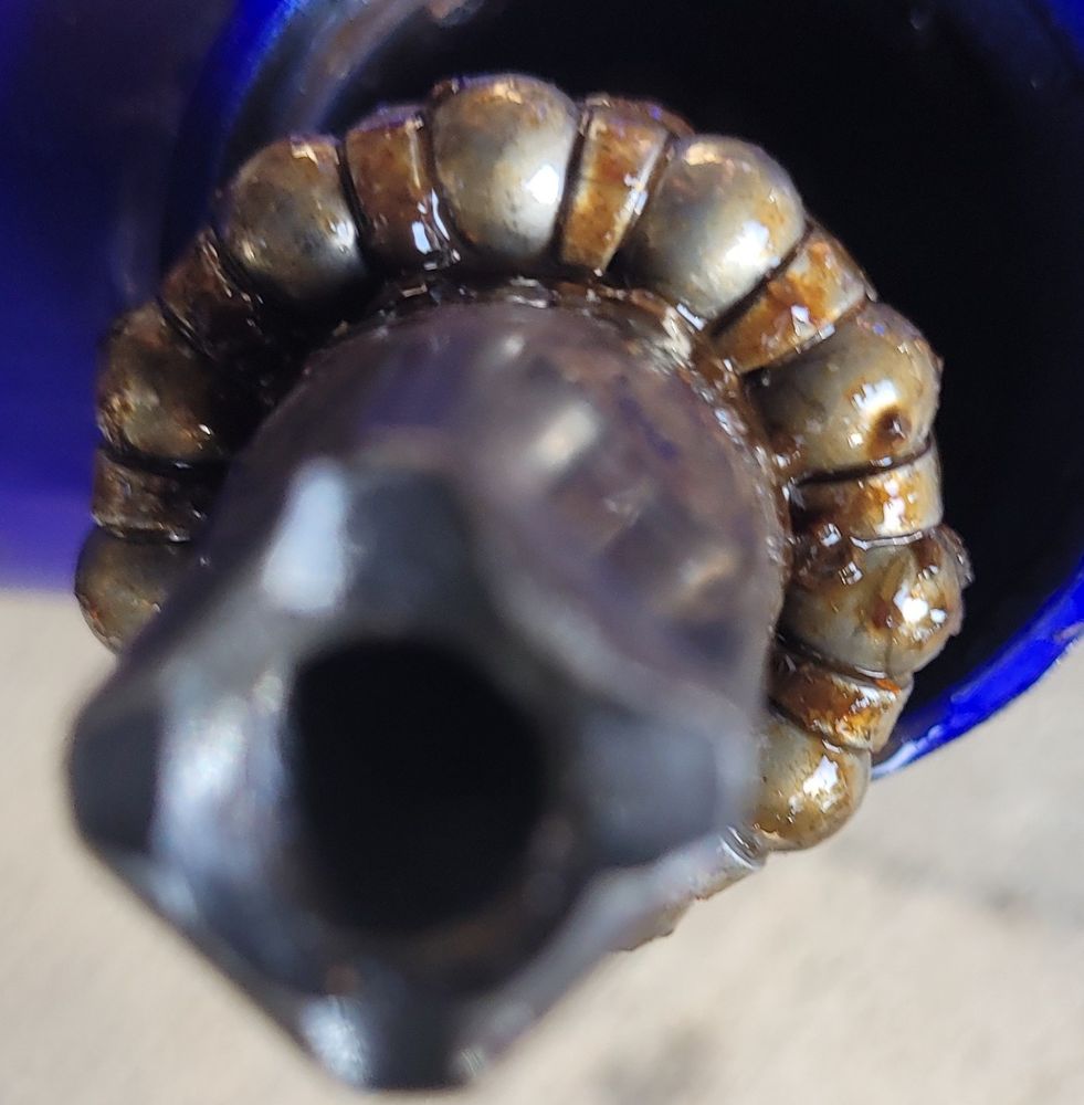 Crank and grimy bearings removed from a bottom bracket