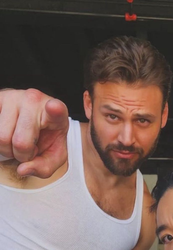 Ryan Guzman (looking hot) pointing at you, the viewer.