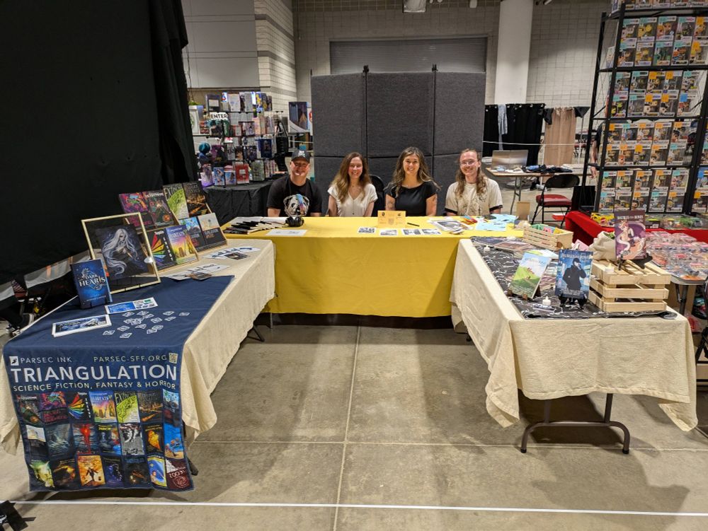 Our setup at 3Rivers Comicon, split between Triangulation and Baubles From Bones with books presented on both sides of a U-shaped booth. 