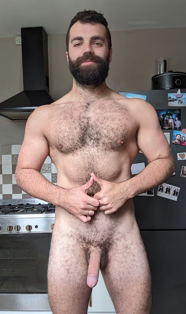 A picture of me standing in the kitchen, naked. 