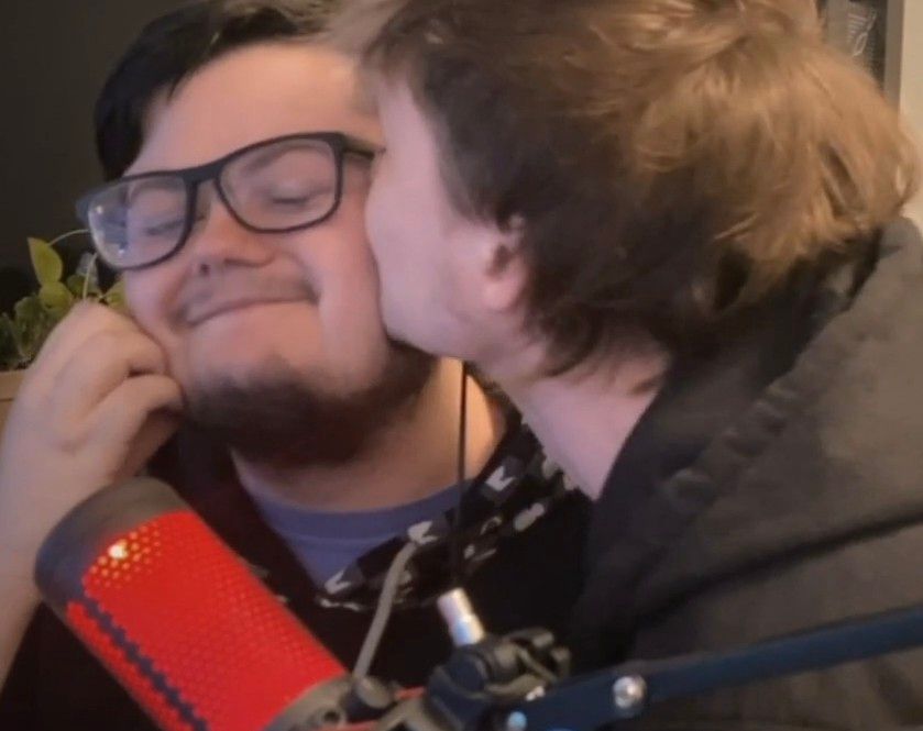 screencapture from a stream, cosmic is kissing raxyn on the cheek