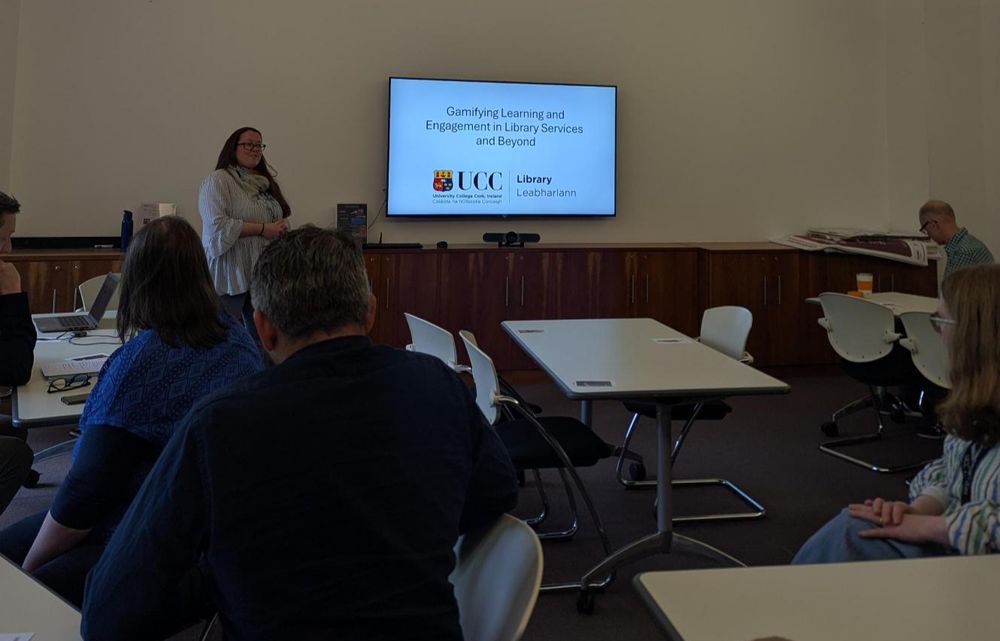 A presenter at the front of the room introducing UCC Library's gamifying learning and engagement in library services and beyond day. 