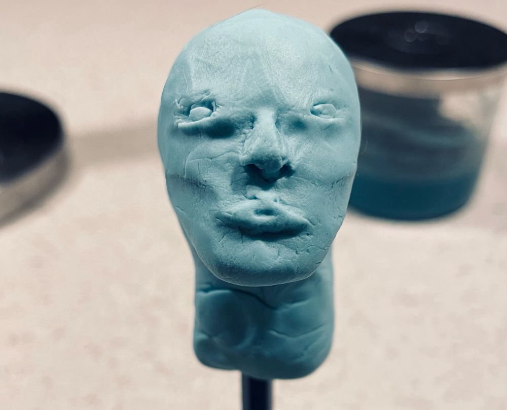 attempt at shaping a humanoid face in blue play doh. 