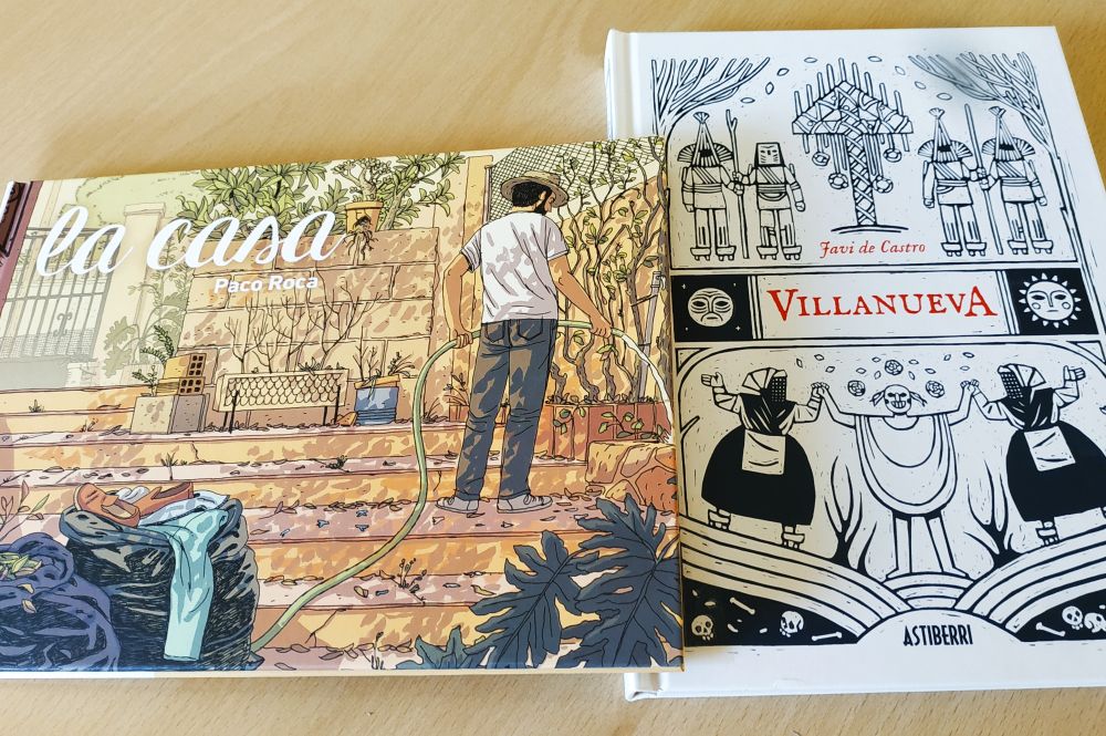 Fotografía de dos comics. La casa, de Paco Roca y Villanueva, se Javi de Castro