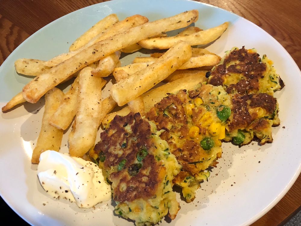 Grated veggie & chickpea flour fritters,oven chips sprinkled with rosemary & a dollop of sour cream. FYI the veggies are: zucchini,red onion,carrot,cheese & peas & corn(& s&p!)