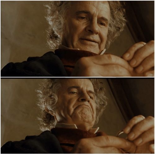 bilbo looking down at ring with smile, then serious grimace showing resolve to keep it, hesitance to give it up