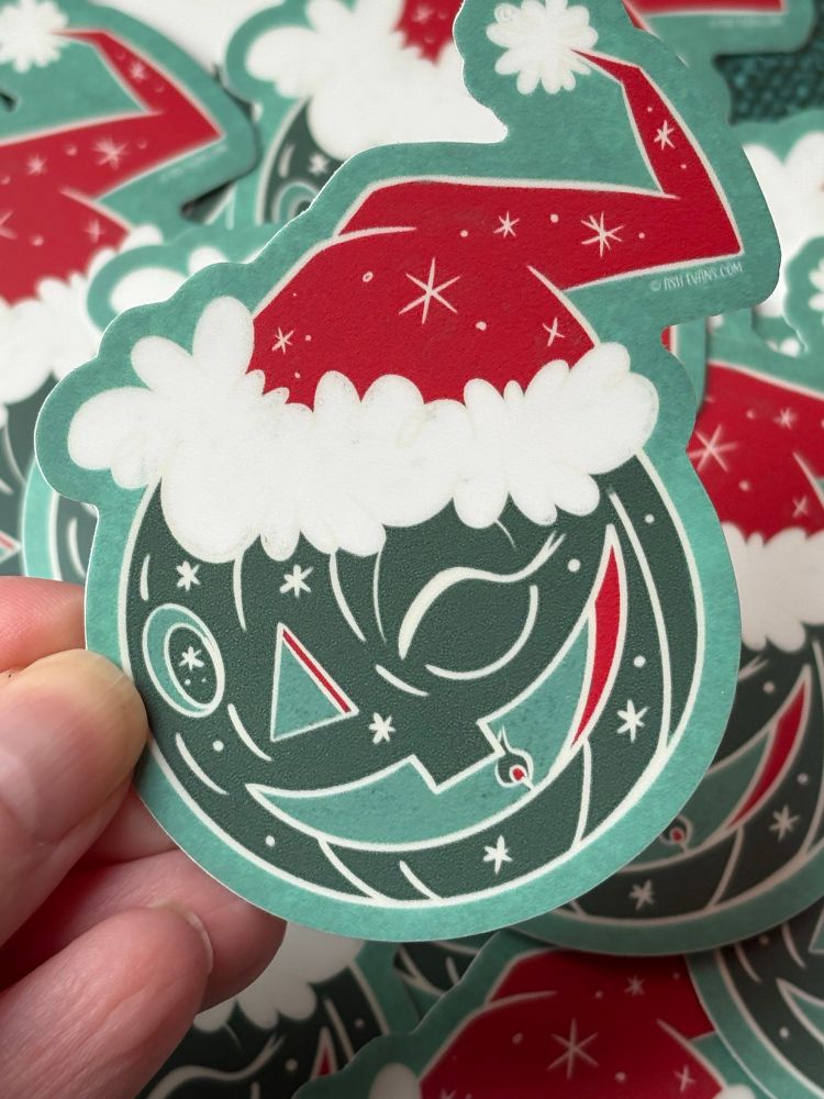 Jolly holiday jack o lantern wearing a Santa hat 