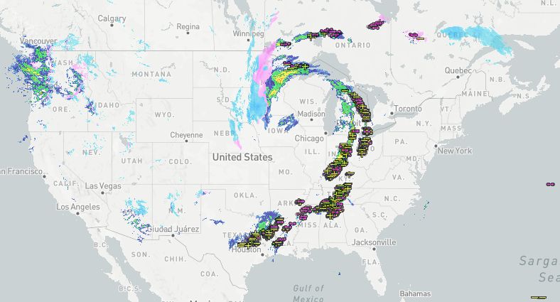 Composite radar of the U.S. and Canada, with lightning in the past 15 minutes from 6:23-6:38 shown (pink and yellow symbols).
