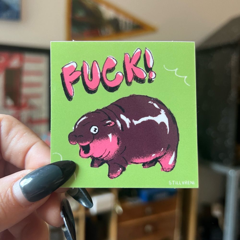 holding up a sticker of Moo Deng yelling FUCK! 
#art #sticker #moodeng