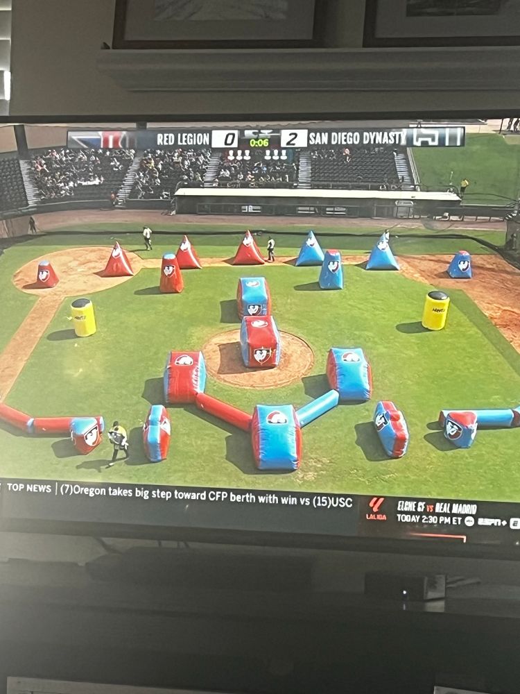 Professional paintball is being played on tv 