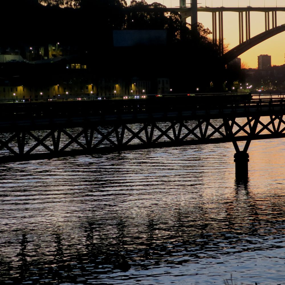 Two bridges over the River Douro at sunset
