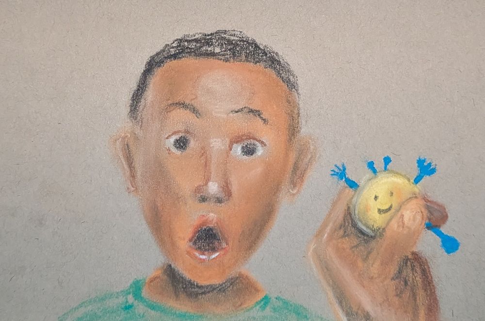 A boy showing his surprise for having a Coinbot9000 behind his ear