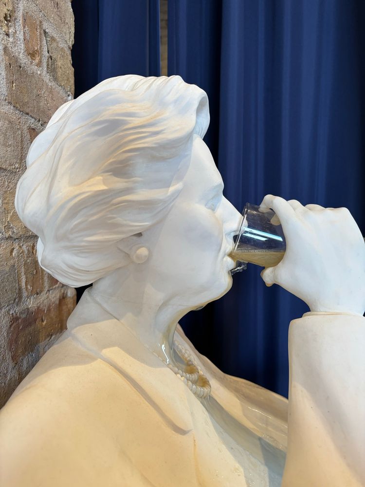 Mrs Thatcher knocking back some privatised water in the Ministry of Sewers.
