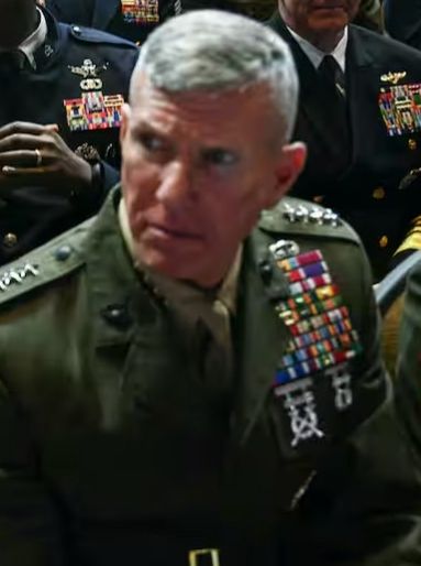 Closeup of a (possibly 4-star) general looking to his right, making a horrified face 