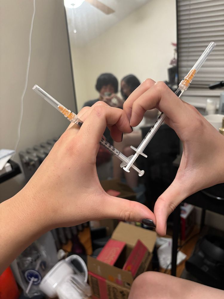 heart symbol with hands and estrogen needles done by the aforementioned faggots