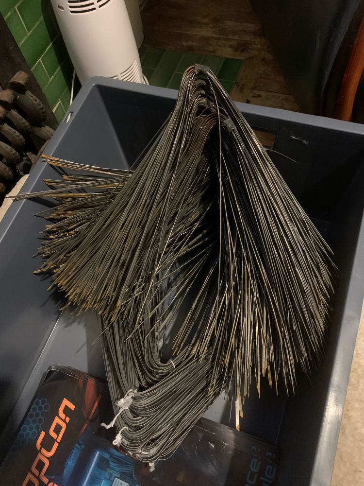 A large pile of steel bristles recovered from street sweeper brushes - waiting to be cleaned up and recycled into lock picking tools. 