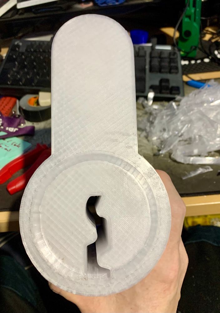 An oversized 3D printed cutaway lock body and plug, after removing bridging material, assembled to see if they fit together (front view). I ran out of clear filament, so the back part is in a local shade of blue. 🤣