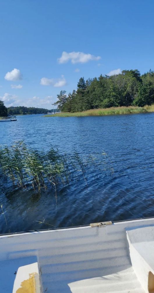 Photo from Ingarö, an island in Värmdö Municipality, Stockholm County. You can see part of a row boat in the front and a lot of water - this is the Baltic Sea.