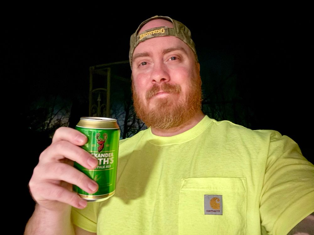 Cold gay man holding a beer 