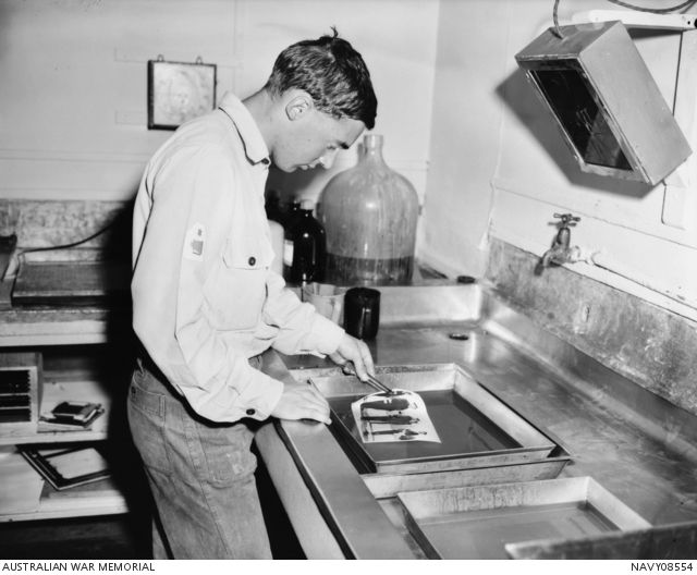 A man developing a photograph