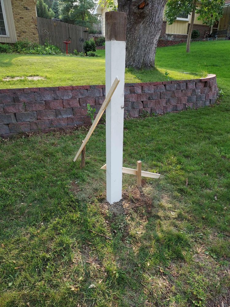Didn't leave the hole too long, put the post in with concrete to support it, and a couple of supports briefly to make sure it's level.