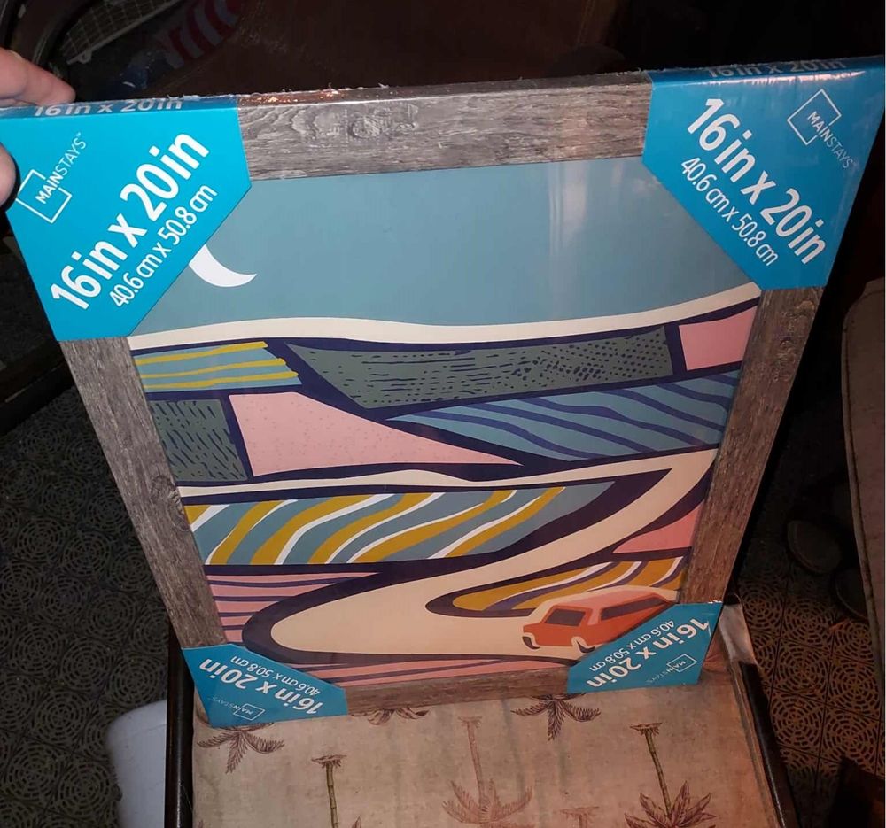 A still wrapped wooden picture frame. It's a convenient size and can be reinforced and the glass can be easily replaced! Will weather-seal it on the inside and such.
