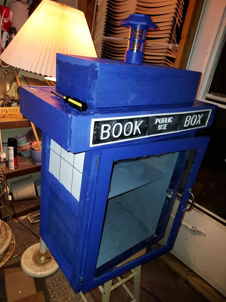 The TARDIS book box with white windows and rods across them to replicate the windows.