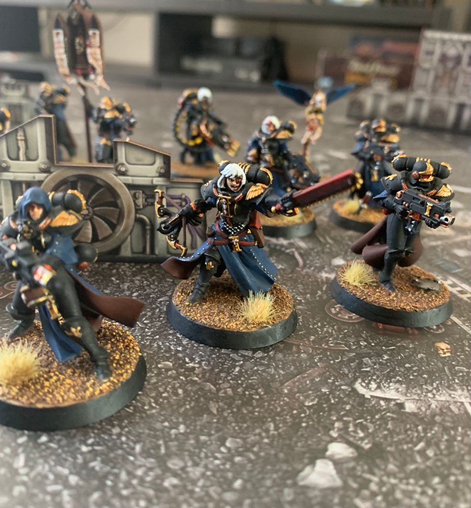 A painted Adepta Sororitas squad.