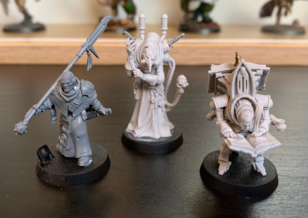 A group of unpainted miniatures, forming part of a Warhammer 40K Kill Team.
