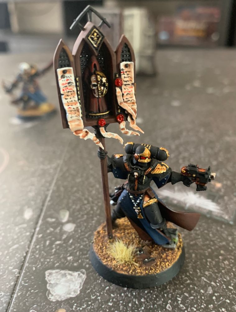 A painted Adepta Sororitas Battle Sister with relic.