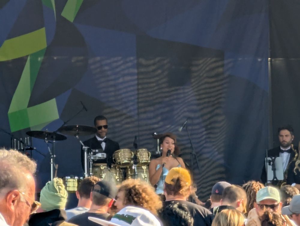The sultry songstress Raye on stage at the 2025 Newport Jazz Festival. Her drummer and saxophonist from her incredible horn section flank her to the rear. They killed it! An impossible act to follow!