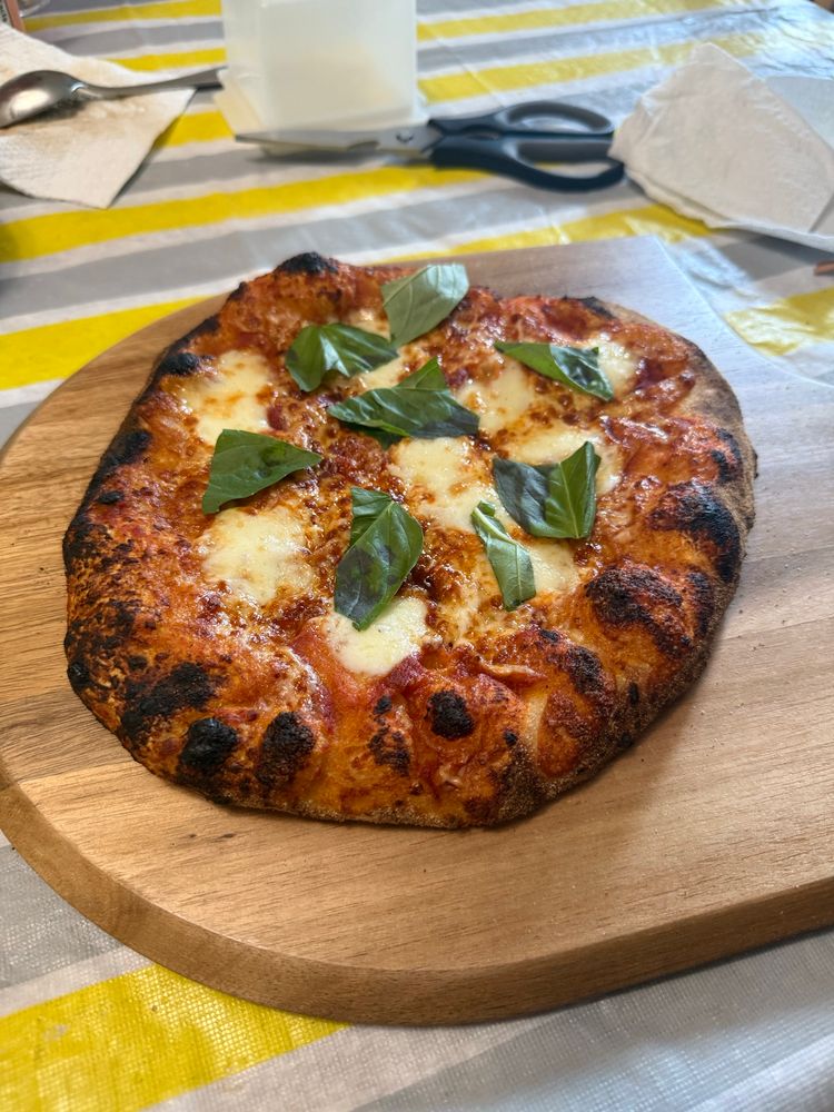 Margherita pizza for the daughter! Sauce, light mozzarella, bocconcini and finished with fresh basil!