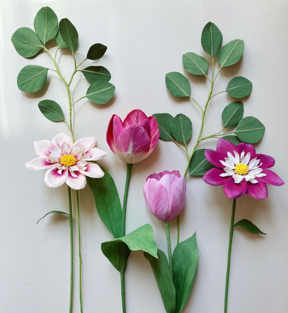 Some paper flowers : 2 pink tulips, 2 eucalyptus branches and 2 pink dahlias