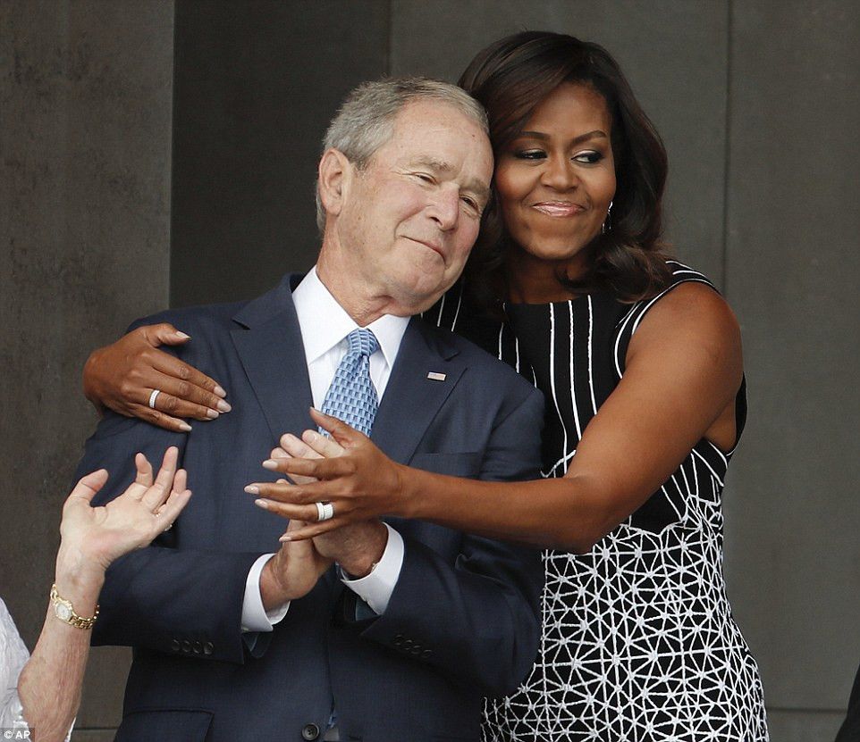 A photo of Michelle Obama hugging GW Bush.