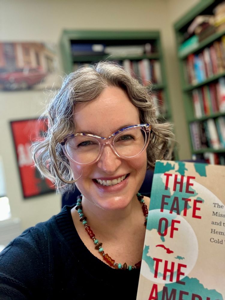 Photo of Renata Keller holding her author copy of The Fate of the Americas: The Cuban Missile Crisis and the Hemispheric Cold War
