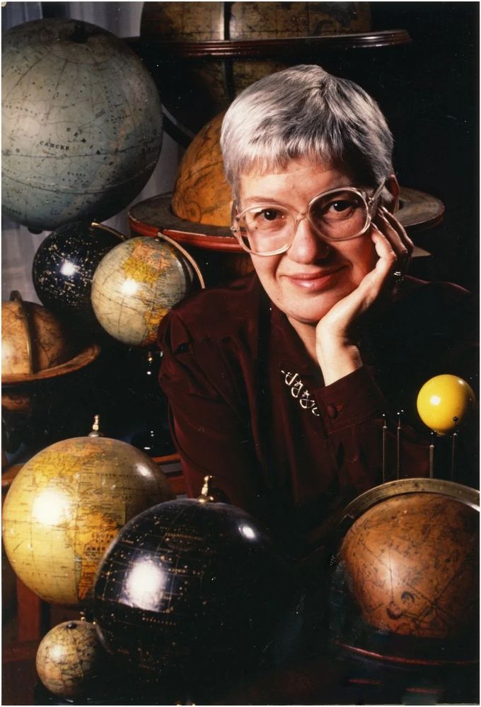 Portrait pic of Vera C. Rubin surrounded by globes of different planets.
Image courtesy of Mark Godfrey (photographer).