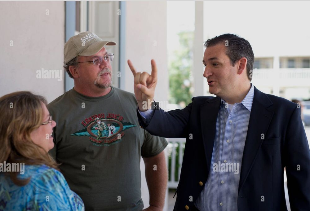 A photo of Ted Cruz throwing the horns similar to what Mr. Reyes Barrios did (although only using one hand, not two).