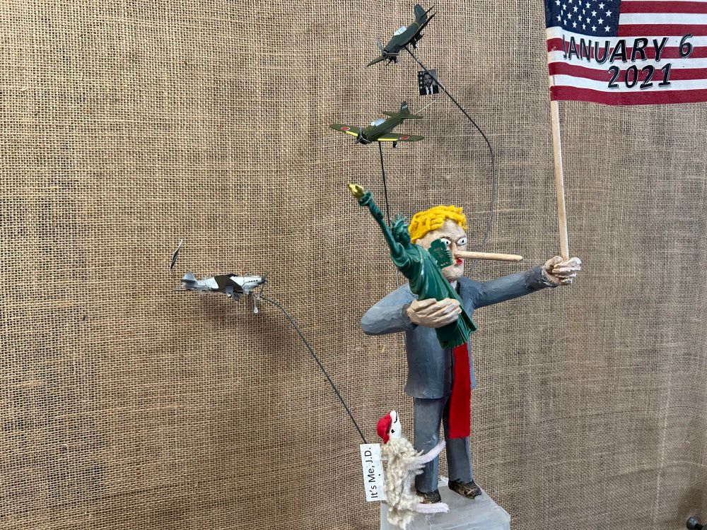 A zoomed in picture of the top of the tower, showing all the details.