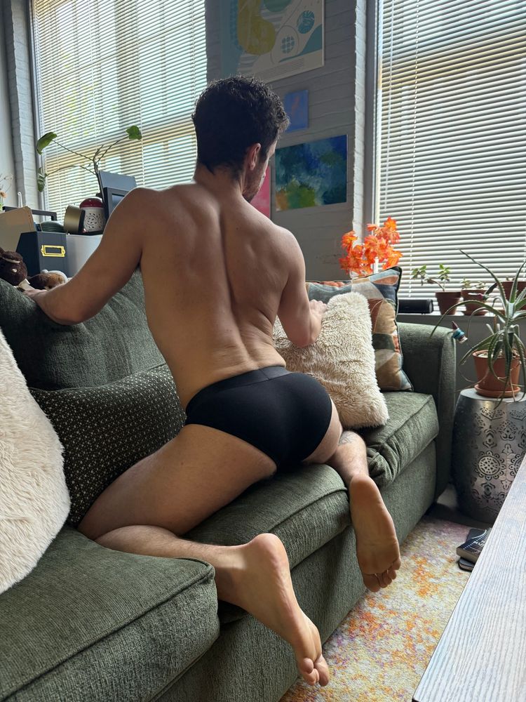 Sexy twink arching his back showing off his ass in black briefs. Muscle bottom. Boy next door. Feet. Hole.